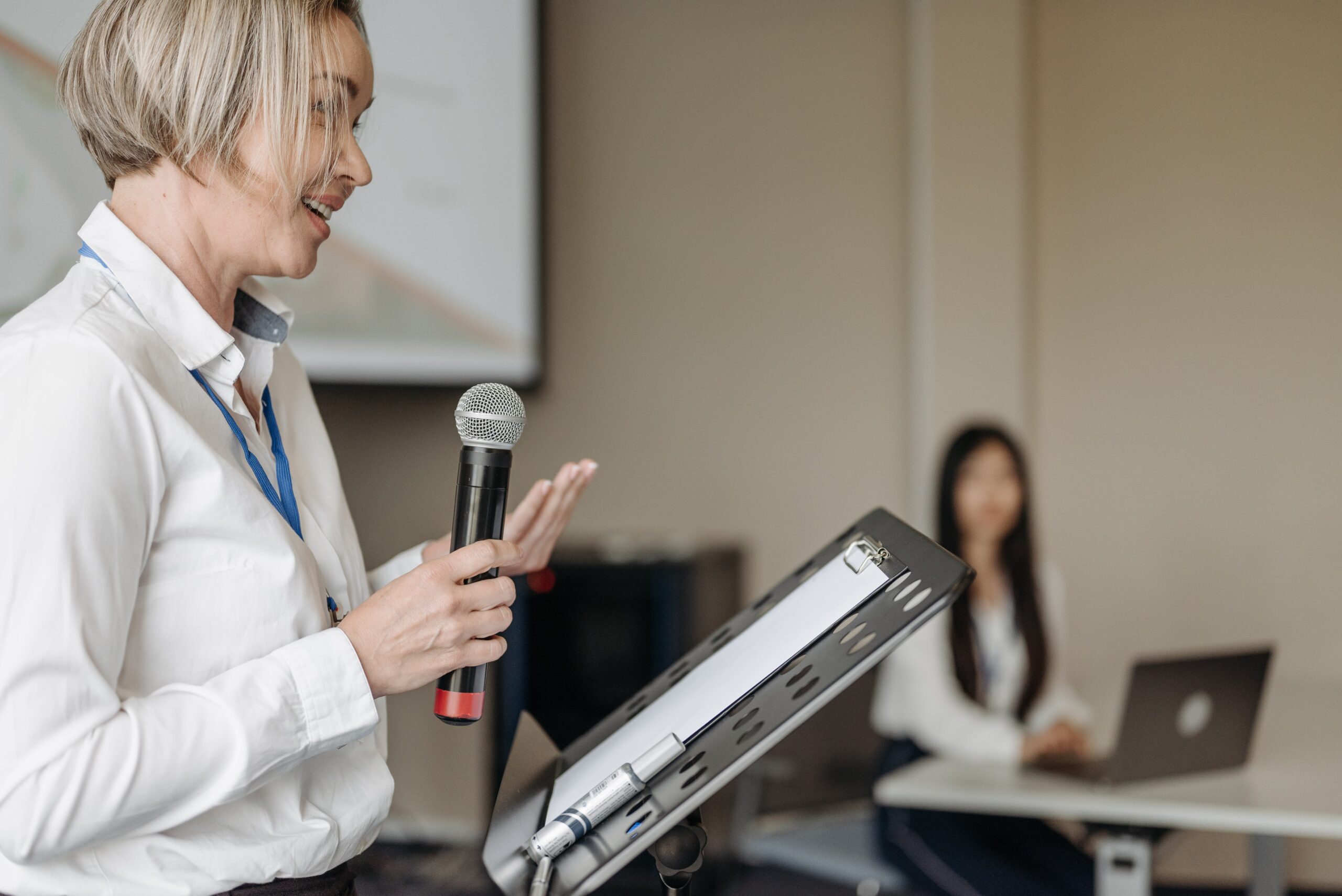 blond woman giving a presentation
