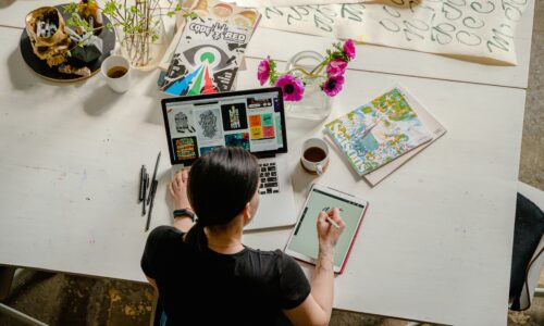 woman doing art on her computer