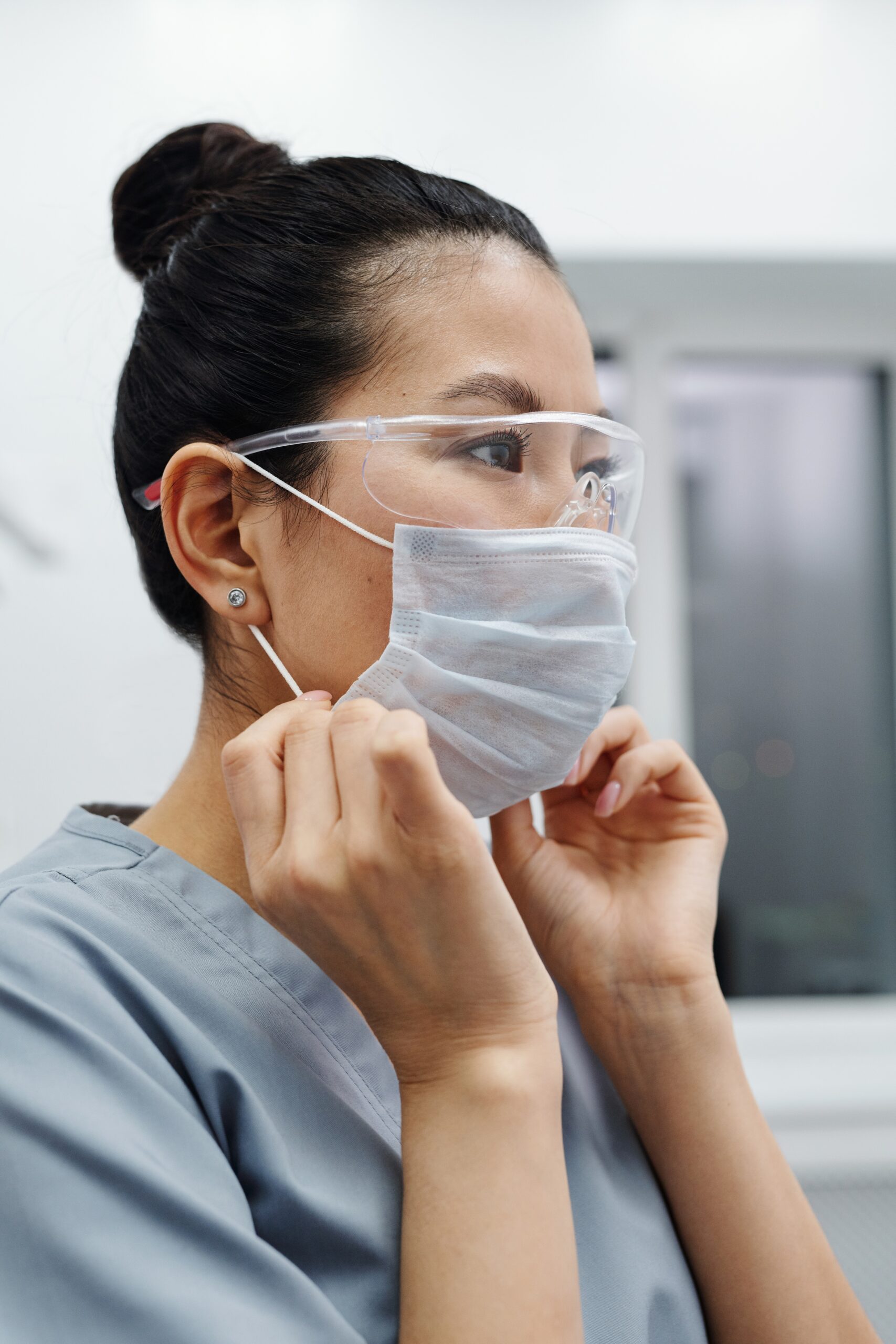 woman wearing protective mask and goggles