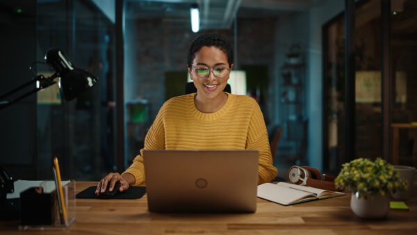 Portrait of Young Marketing Specialist Working on Laptop Computer.